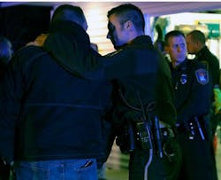 Law enforcement officers console each other as they looked in on the hearse carrying the body of fallen Officer Tom Decker at Wenners Funeral home in Cold Spring, Minn. on Nov. 30. Law enforcement officers console each other as they looked in on the hearse carrying the body of fallen Officer Tom Decker at Wenners Funeral home in Cold Spring, Minn. on Nov. 30.