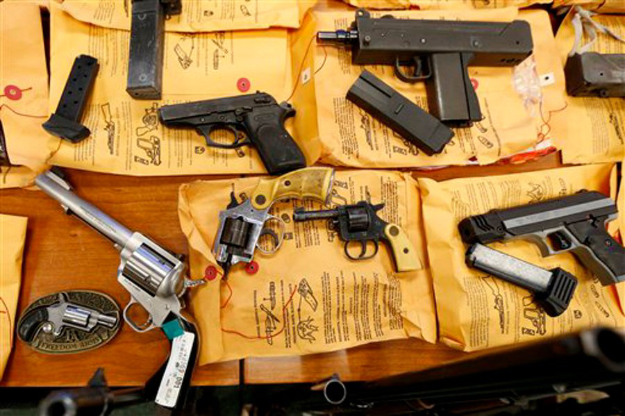 Guns are on display during a news conference talking about the seizure of weapons during the Passaic River Corridor Initiative on Dec. 5 in Newark, N.J.