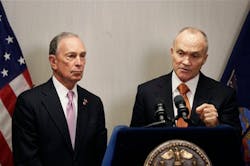 New York City Mayor Michael Bloomberg, left, and Police Commissioner Raymond Kelly speak to the media after a Police Academy graduation ceremony on Dec. 28.
