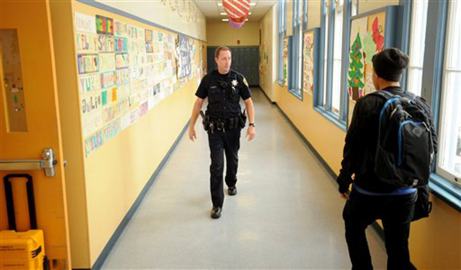Officer Rick Moore of the Oakland School District Police patrols Oakland Technical High School in Oakland, Calif. on Dec. 17.