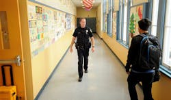 Officer Rick Moore of the Oakland School District Police patrols Oakland Technical High School in Oakland, Calif. on Dec. 17. Officer Rick Moore of the Oakland School District Police patrols Oakland Technical High School in Oakland, Calif. on Dec. 17.