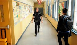 Officer Rick Moore of the Oakland School District Police patrols Oakland Technical High School in Oakland, Calif. on Dec. 17.