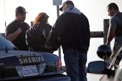 A person is detained in Rancho Palos Verdes, Calif. on Dec. 10 as law enforcement personnel stopped several people that were believed to be illegal immigrants. A person is detained in Rancho Palos Verdes, Calif. on Dec. 10 as law enforcement personnel stopped several people that were believed to be illegal immigrants.