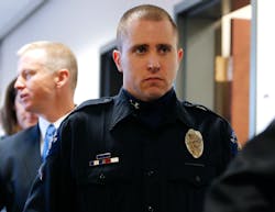 Aurora Police Officer Justin Grizzle leaves court after testifying at a preliminary hearing for James Holmes at the courthouse in Centennial, Colo. on Jan. 7. Aurora Police Officer Justin Grizzle leaves court after testifying at a preliminary hearing for James Holmes at the courthouse in Centennial, Colo. on Jan. 7.
