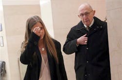 Fallen NYPD Officer Peter Figoski's father Frank Figoski, right, and daughter Corrine arrive for the first day or the murder trial of two men accused of shooting him to death. Fallen NYPD Officer Peter Figoski's father Frank Figoski, right, and daughter Corrine arrive for the first day or the murder trial of two men accused of shooting him to death.