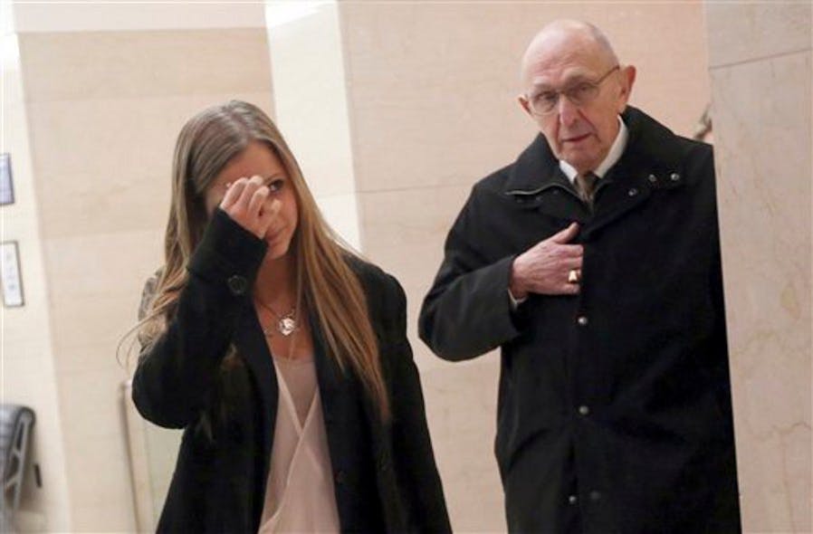 Fallen NYPD Officer Peter Figoski&apos;s father Frank Figoski, right, and daughter Corrine arrive for the first day or the murder trial of two men accused of shooting him to death.