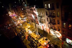 Fire trucks stretch for blocks after a five alarm fire at 41 Spring Street in lower Manhattan burned through the building on Jan. 10. Fire trucks stretch for blocks after a five alarm fire at 41 Spring Street in lower Manhattan burned through the building on Jan. 10.