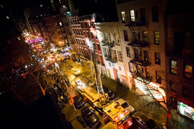 Fire trucks stretch for blocks after a five alarm fire at 41 Spring Street in lower Manhattan burned through the building on Jan. 10.