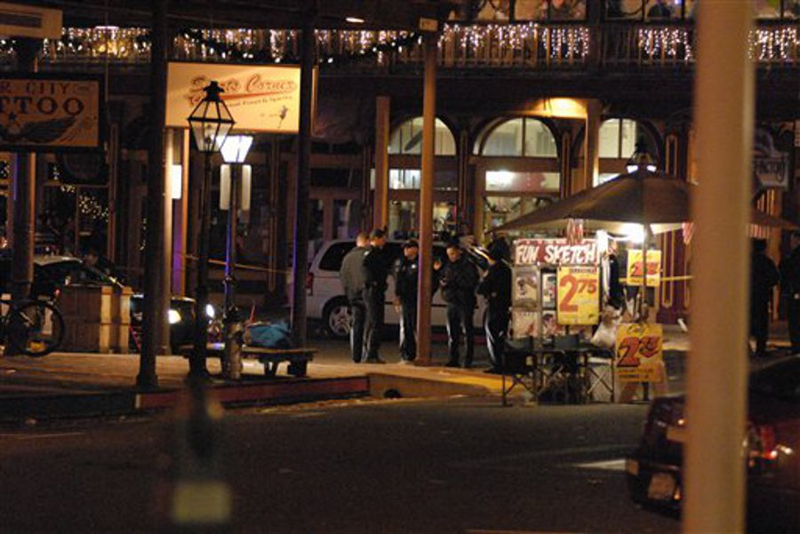 Police inspect the scene of a shooting outside the Sports Corner Cafe in Sacramento Calif. on Dec. 31.
