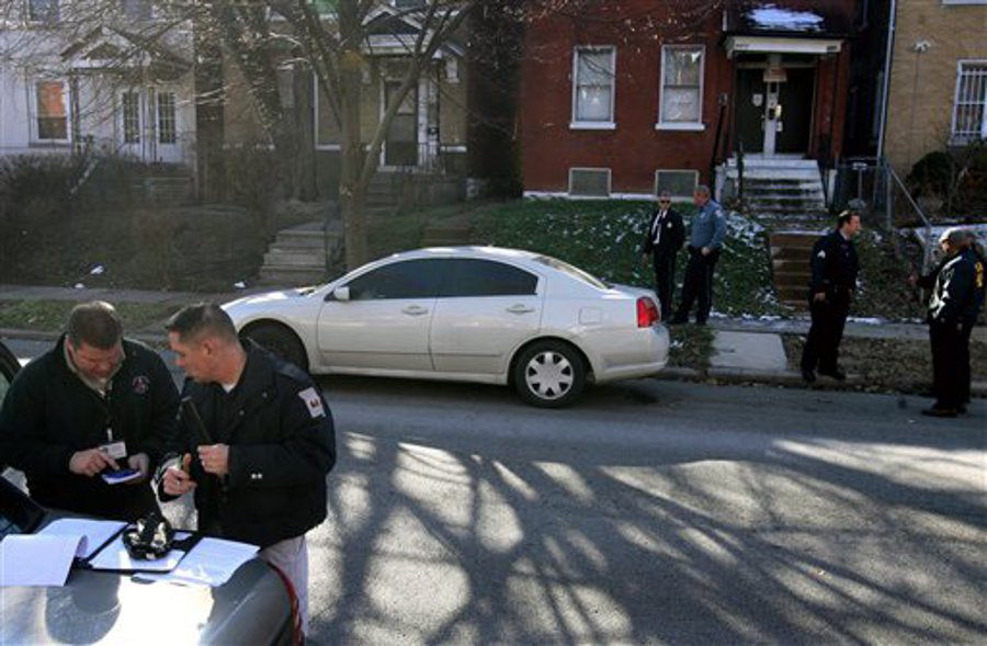 Police officers inspect a car belonging to missing woman Ebony Jackson that was found in St. Louis on Jan. 8.