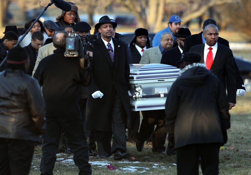The casket containing the body of Hadiya Pendleton is carried to her burial site at Cedar Park Cemetery in Riverdale, Ill. on Feb. 9.