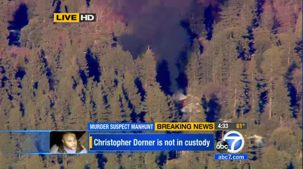 The cabin in Big Bear, Calif. where ex-Los Angeles police officer Christopher Dorner was believed to be barricaded inside is seen in flames Tuesday, Feb. 12, 2013.