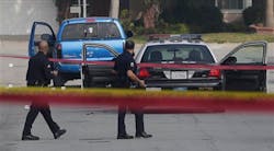 LAPD Officers pass by at a truck in Torrance, Calif. on Feb. 7 that mistakenly shot at after authorities believed it was the same one driven by Christopher Dorner. LAPD Officers pass by at a truck in Torrance, Calif. on Feb. 7 that mistakenly shot at after authorities believed it was the same one driven by Christopher Dorner.