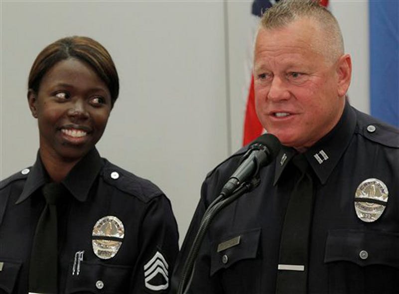Husband and wife, Sgt. Emada Tingirides and Capt. Phil Tingirides speak during a news conference on Feb. 19 in Los Angeles.