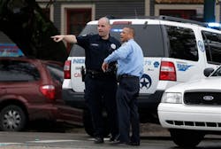 Police point towards a parking lot where a truck containing suspicious packages was parked in New Orleans on Feb. 25. Police point towards a parking lot where a truck containing suspicious packages was parked in New Orleans on Feb. 25.