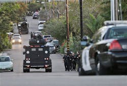 An armored vehicle arrives in support of police and sheriff's officers outside a home in Encinitas, Calif. on Feb. 20. An armored vehicle arrives in support of police and sheriff's officers outside a home in Encinitas, Calif. on Feb. 20.