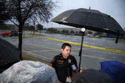 Grapevine Police Dept. PIO Sgt. Robert Eberling speaks to the press at a mobile police command center in a parking lot in Grapevine, Texas on Feb. 12.