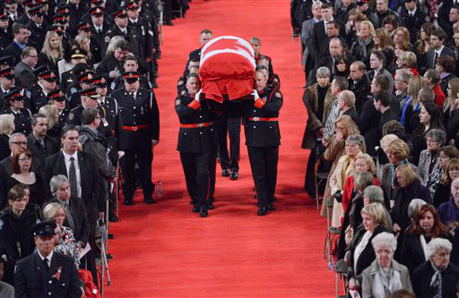 Pallbearers carry the casket of Const. Jennifer Kovach at her funeral in Guelph, Ontario, Canada, on March 21.