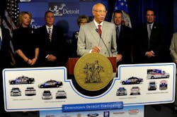 Detroit Mayor Dave Bing, center, unveils an ambitious plan by local business leaders to fund the purchase of public safety vehicles for the cash-strapped city on March 25.