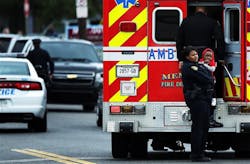 A Memphis police officer comforts a small child outside an ambulance on the 900 block of Mississippi Street on March 4.