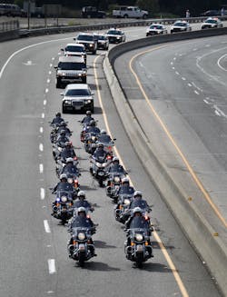 A procession of police officers from supporting agencies, coming from Santa Cruz heads north on Hwy 17 near Bear Creek Road on their way to HP Pavilion in San Jose, Calif. on March 7. A procession of police officers from supporting agencies, coming from Santa Cruz heads north on Hwy 17 near Bear Creek Road on their way to HP Pavilion in San Jose, Calif. on March 7.