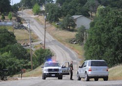 A Calaveras County Sheriff&apos;s deputy detains a driver on Rippon Rd. in Valley Springs, Calif., where 8-year-old Leila Fowler was found murdered.