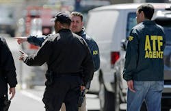 A Boston police officer, front left, talks with two ATF agents at the scene of the Boston Marathon explosions A Boston police officer, front left, talks with two ATF agents at the scene of the Boston Marathon explosions
