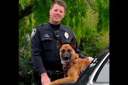 Police dog Rico is seen with his handler, Police Officer Mike Page.