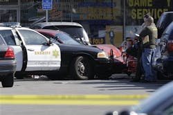Los Angeles County Sheriff investigators view the scene of a confrontation between a deputy and a civilian at a strip mall in the unincorporated Athens area of South Los Angeles on April 26. Los Angeles County Sheriff investigators view the scene of a confrontation between a deputy and a civilian at a strip mall in the unincorporated Athens area of South Los Angeles on April 26.