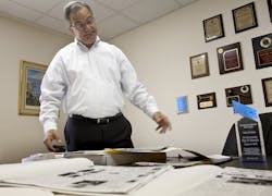Paul Novack looks through boxes of files he has compiled in researching the 47-year-old kidnapping case of Danny Goldman, in his office in North Miami, Florida, on March 26.