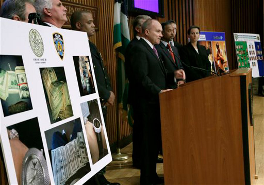 NYPD Commissioner Raymond Kelly,right center, answers questions during a new conference at the department's headquarters on April 12.