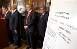 An poster with an enlarged view of the dismissal of the 2001 Los Angeles Police Department consent decree is seen as the mayor, police chief, and police commission board members appear at police headquarters on May 16. An poster with an enlarged view of the dismissal of the 2001 Los Angeles Police Department consent decree is seen as the mayor, police chief, and police commission board members appear at police headquarters on May 16.