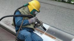 An engraver is seen adding names to the National Law Enforcement Officers Memorial in preparation for the 25th Annual Candlelight Vigil, set for May 13 in Washington, D.C. (National Law Enforcement Officers Memorial Fund) An engraver is seen adding names to the National Law Enforcement Officers Memorial in preparation for the 25th Annual Candlelight Vigil, set for May 13 in Washington, D.C. (National Law Enforcement Officers Memorial Fund)