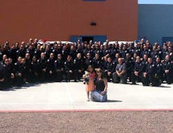 Tatum Raetz, the daughter of fallen Phoenix Officer Daryl Raetz, was joined by close to 100 officers at her kindergarten graduation on May 22. Tatum Raetz, the daughter of fallen Phoenix Officer Daryl Raetz, was joined by close to 100 officers at her kindergarten graduation on May 22.