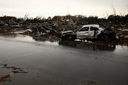 A Del City police car sits damaged along Kings Manor in Moore, Okla on May 21. A Del City police car sits damaged along Kings Manor in Moore, Okla on May 21.