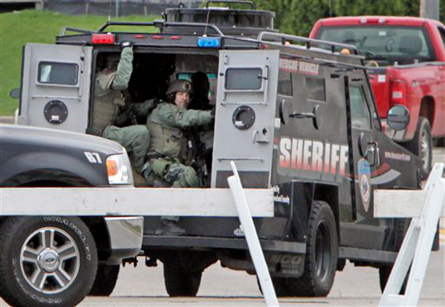 The Dane County Sheriff's Office Tactical Response Team drives away from a makeshift command center at Fire Station 2 in Fitchburg, Wis. on May 2.