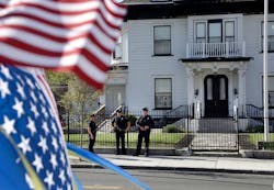 Police keep watch outside Graham, Putnam, and Mahoney Funeral Parlors in Worcester, Mass. on May 6.