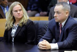 Defendant Joseph Weekely, right, and A&amp;E producer Allison Howard, who was at the raid, sit in court before Judge Cynthia Gray Hathaway at Frank Murphy Hall of Justice in Detroit.
