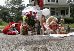 Blood stains and a make shift memorial for 18-year-old Jamal Jones is seen where police found him with gunshots wounds to the shoulder and chest over the past weekend, on Chicago&apos;s Southside on June 17.