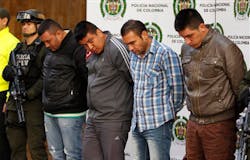 Police present to the press four alleged gang members who were arrested in connection with the murder of U.S. DEA Special Agent James 'Terry' Watson at police headquarters in Bogota, Colombia on June 26. Police present to the press four alleged gang members who were arrested in connection with the murder of U.S. DEA Special Agent James 'Terry' Watson at police headquarters in Bogota, Colombia on June 26.