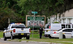 Police gather at the Highlands Baptist Church in Jacksonville, Fla. on June 22 where authorities said the body of 8-year-old Charish Perriwinkle was found.