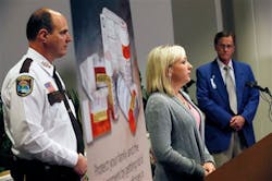 Amanda, center, flanked by Hennepin County Sheriff Rich Stanek left and and North Memorial E.R. Dr. Dave Roberts speaks about her addiction to pain killers, and her uses of heroin during a press conference at North Memorial Hospital in Robbinsdale, Minn. on June 4.