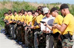 Oklahoma State Trooper Shane Hackler, third from right, instructs cadets on a pistol firing range Oklahoma City on June 11. Oklahoma State Trooper Shane Hackler, third from right, instructs cadets on a pistol firing range Oklahoma City on June 11.