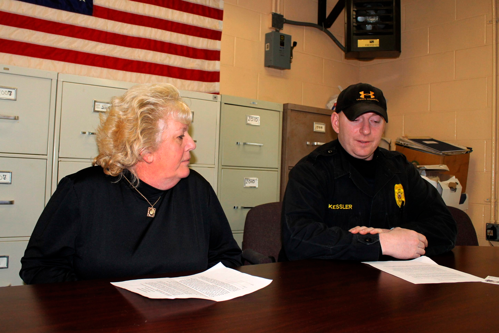 Gilberton Police Chief Mark Kessler, right, explains the purpose of his 'Second Amendment Preservation Resolution' that was adopted at a meeting of the Gilberton Borough Council in Gliberton, Pa. last year.