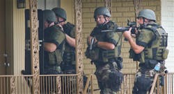 Cobb County Sheriff SWAT officers make entries into empty units at the Concord Chase apartment complex near Smyrna, Ga. on July 12. Cobb County Sheriff SWAT officers make entries into empty units at the Concord Chase apartment complex near Smyrna, Ga. on July 12.
