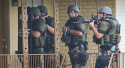Cobb County Sheriff SWAT officers make entries into empty units at the Concord Chase apartment complex near Smyrna, Ga. on July 12.