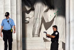 U.S. Park Police close off the Lincoln Memorial to visitors after someone splattered green paint on the statue and the floor area, in Washington on July 26.