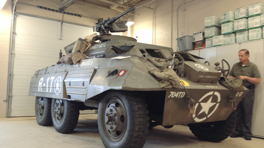 Shelby Township, Mich. Police Chief Roland Woelkers stands with the 1944 M20 armored vehicle that was impounded on July 4.