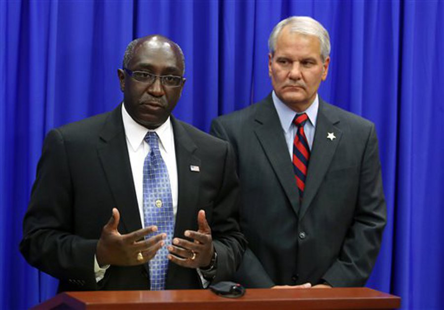 Sanford Police Chief Cecil Smith, left, addresses the media as Seminole County Sheriff Donald Eslinger, right, listens on July 4.