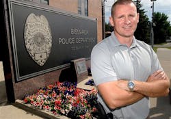 Bismarck Police Officer Kent Kaylor poses outside the Bismarck Police Department on Aug. 28. Bismarck Police Officer Kent Kaylor poses outside the Bismarck Police Department on Aug. 28.